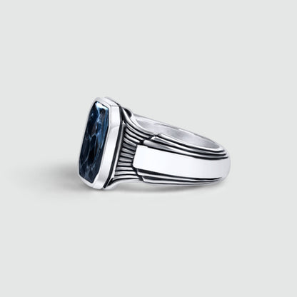 Side view of Bariq sterling silver mens signet ring with a blue stone by NineTwoFive to show the engraved design.